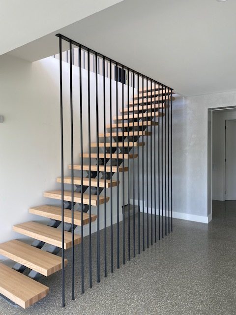 Floating timber stair treads with steel balustrade