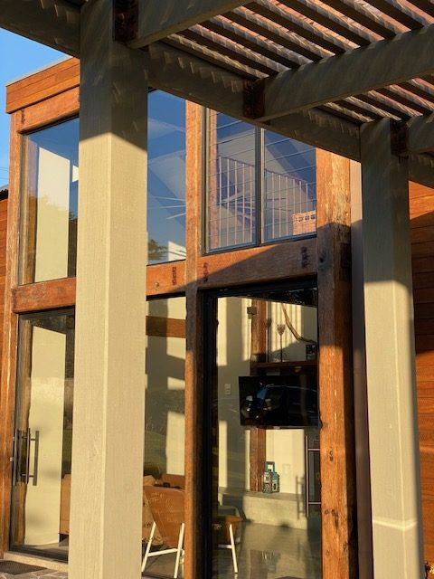 Timber-framed glazing and cladding detail