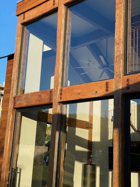 Timber frame glazing with reflected sky